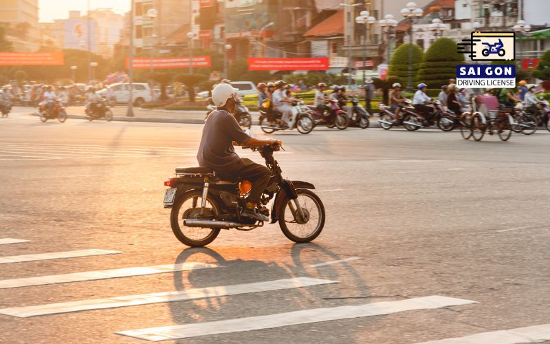 Local people drive motorbikes in Ho Chi Minh city